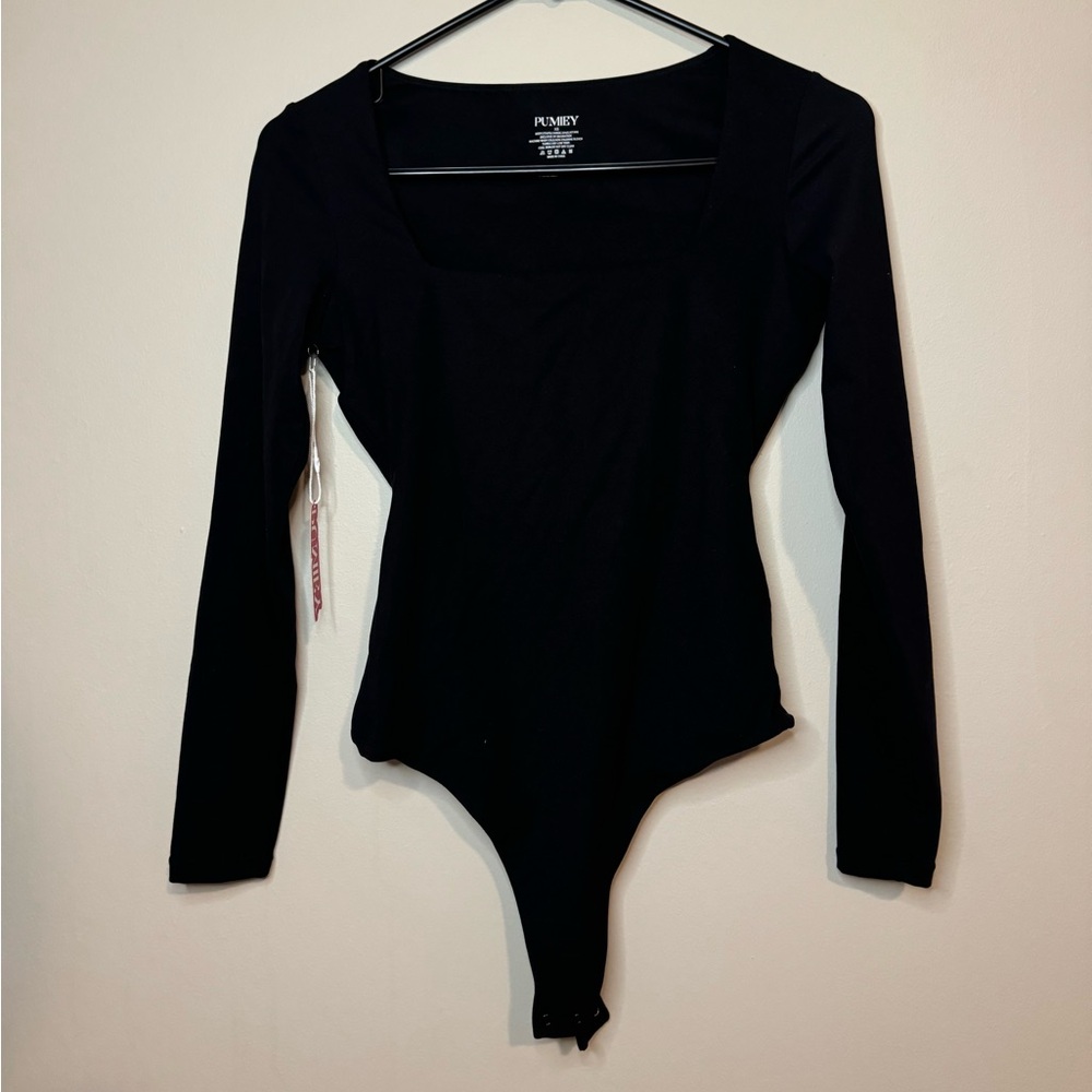 Long sleeve one piece. Very comfortable. Never worn